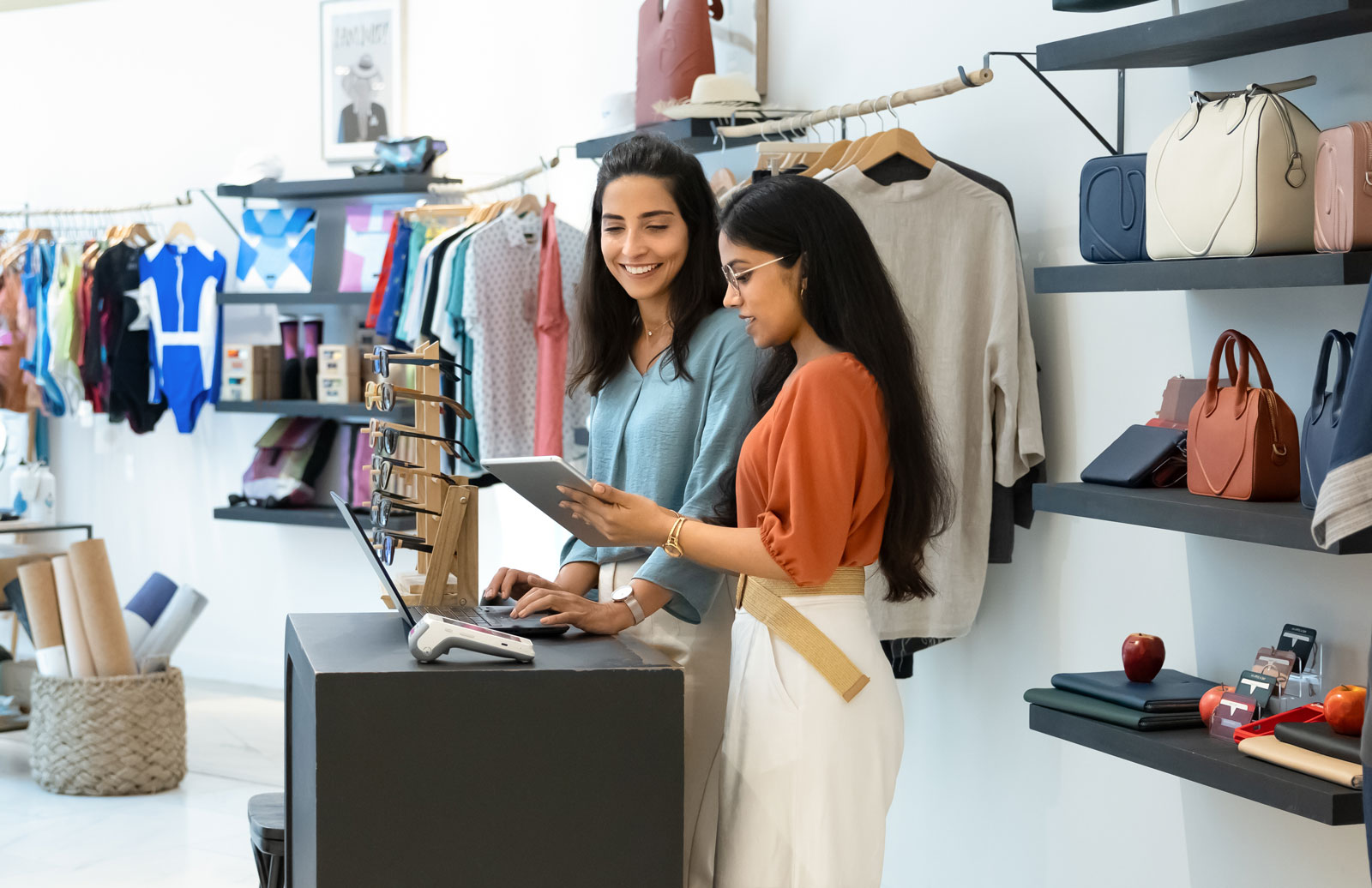 Retail business owners using business internet for point-of-sale and inventory systems